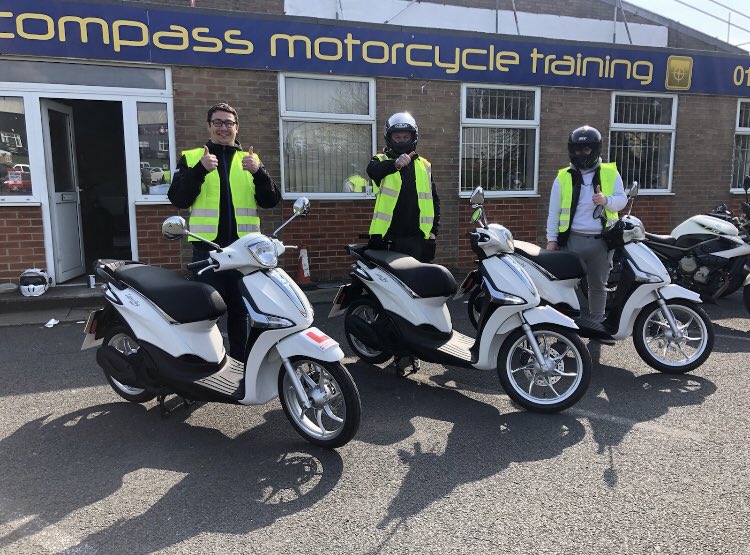 Image of a moped with learner plate